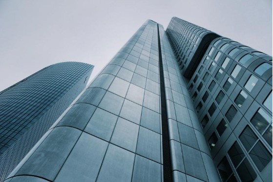 A tall skyscraper building with formal architecture housing construction consultant offices. 